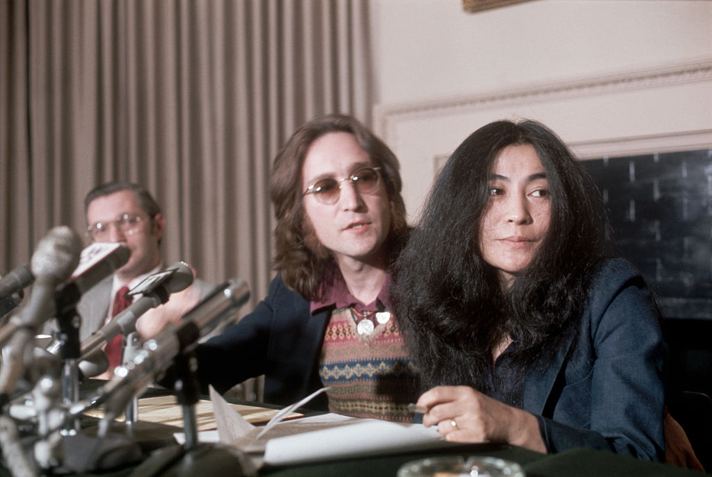 John Lennon and Yoko Ono at a press conference, 1973