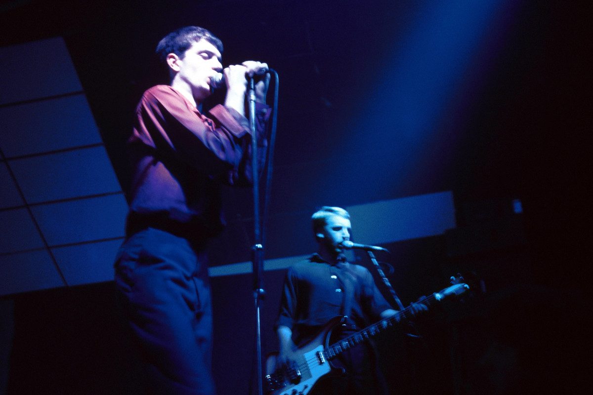 UNITED KINGDOM - ELECTRIC BALLROOM Photo of Peter HOOK and Ian CURTIS and JOY DIVISION, L-R: Ian Curtis, Peter Hook - performing live onstage