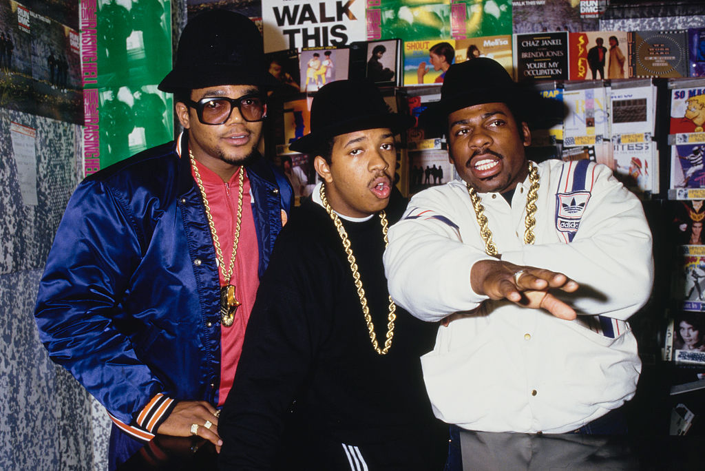 American hip hop group Run-DMC posed in an HMV record store in 1986. Left to right: Darryl 'DMC' McDaniels, Joseph 'Run' Simmons, Jason 'Jam-Master Jay' Mizell