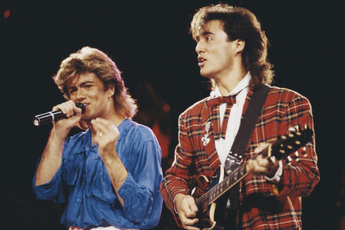 Wham! performing onstage during their 1985 world tour