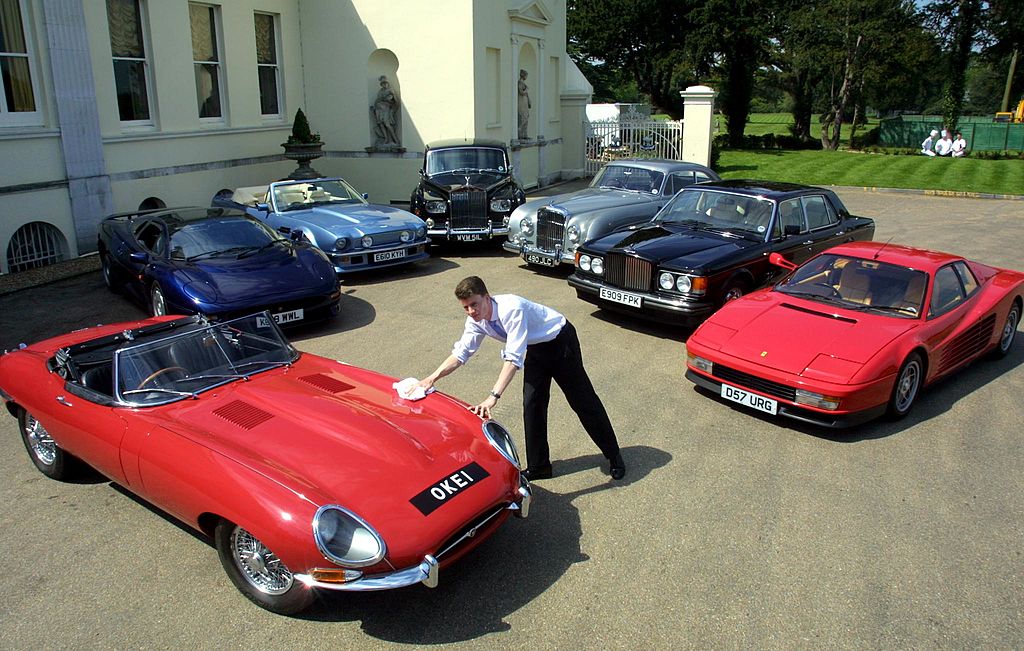 Some of Elton John's car collection, including (from left) a 1965 Jaguar E-type, 1993 Jaguar XJ 220, 1987 Aston Martin V8 Vantage Volante, 1973 Rolls Royce Phantom VI, 1956 Bentley Continental, 1987 Bentley Turbo saloon and a 1987 Ferrari Testarossa