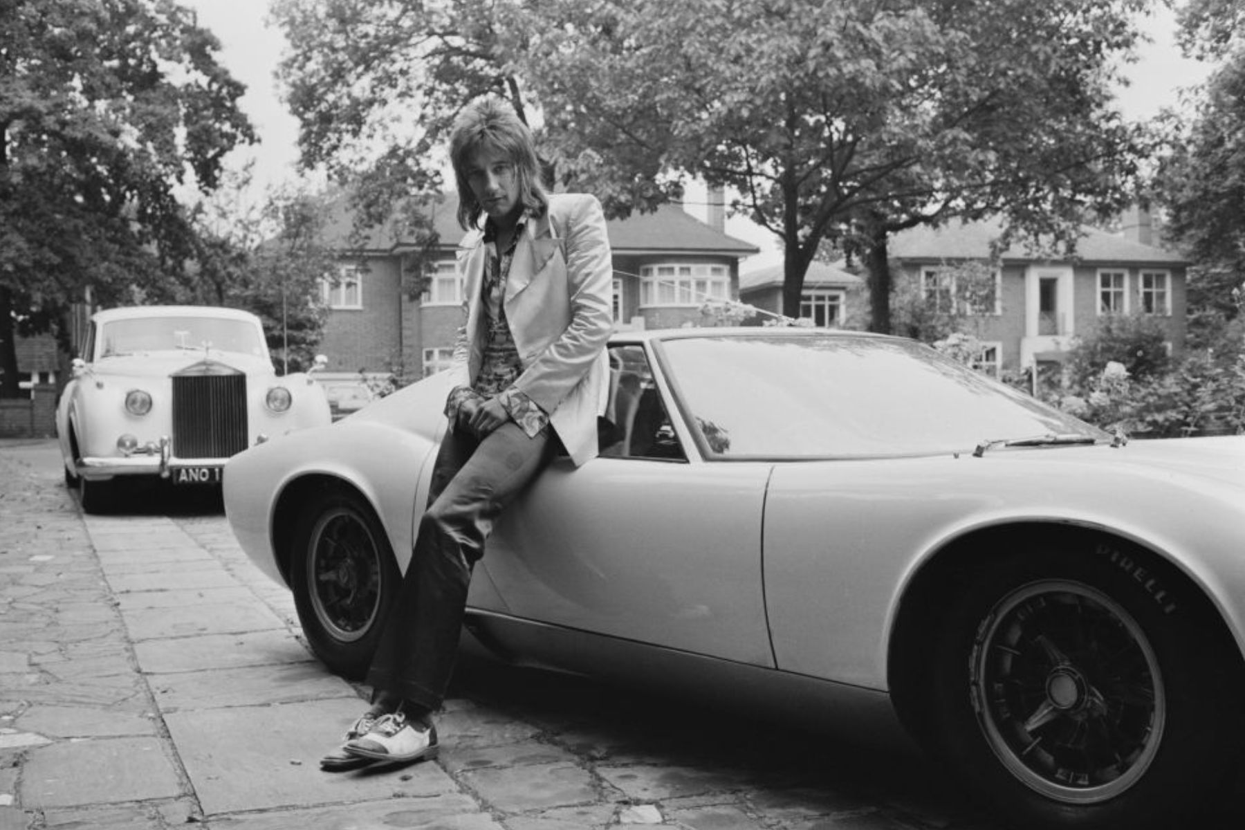British rock singer Rod Stewart with his Lamborghini Miura, UK, 12th September 1971