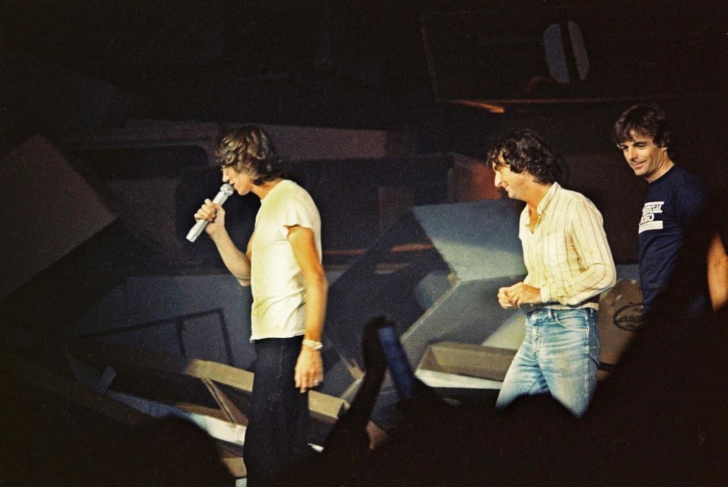 Roger Waters leads Nick Mason and Richard Wright of Pink Floyd back onto the stage at the end of 'The Wall' concert at Earls Court Arena, London, August 7th, 1980