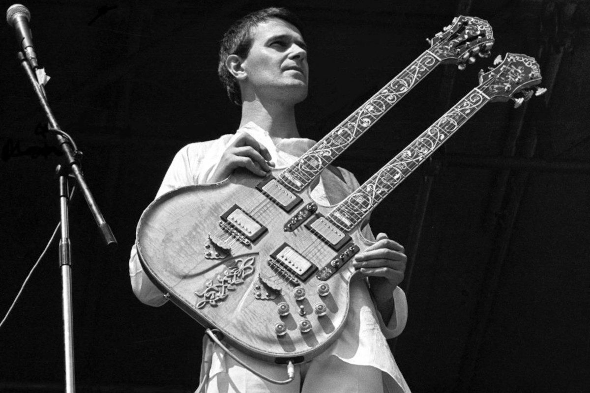 John McLaughlin performing on stage with Mahavishnu Orchestra at Knebworth Festival, 20 July 1974