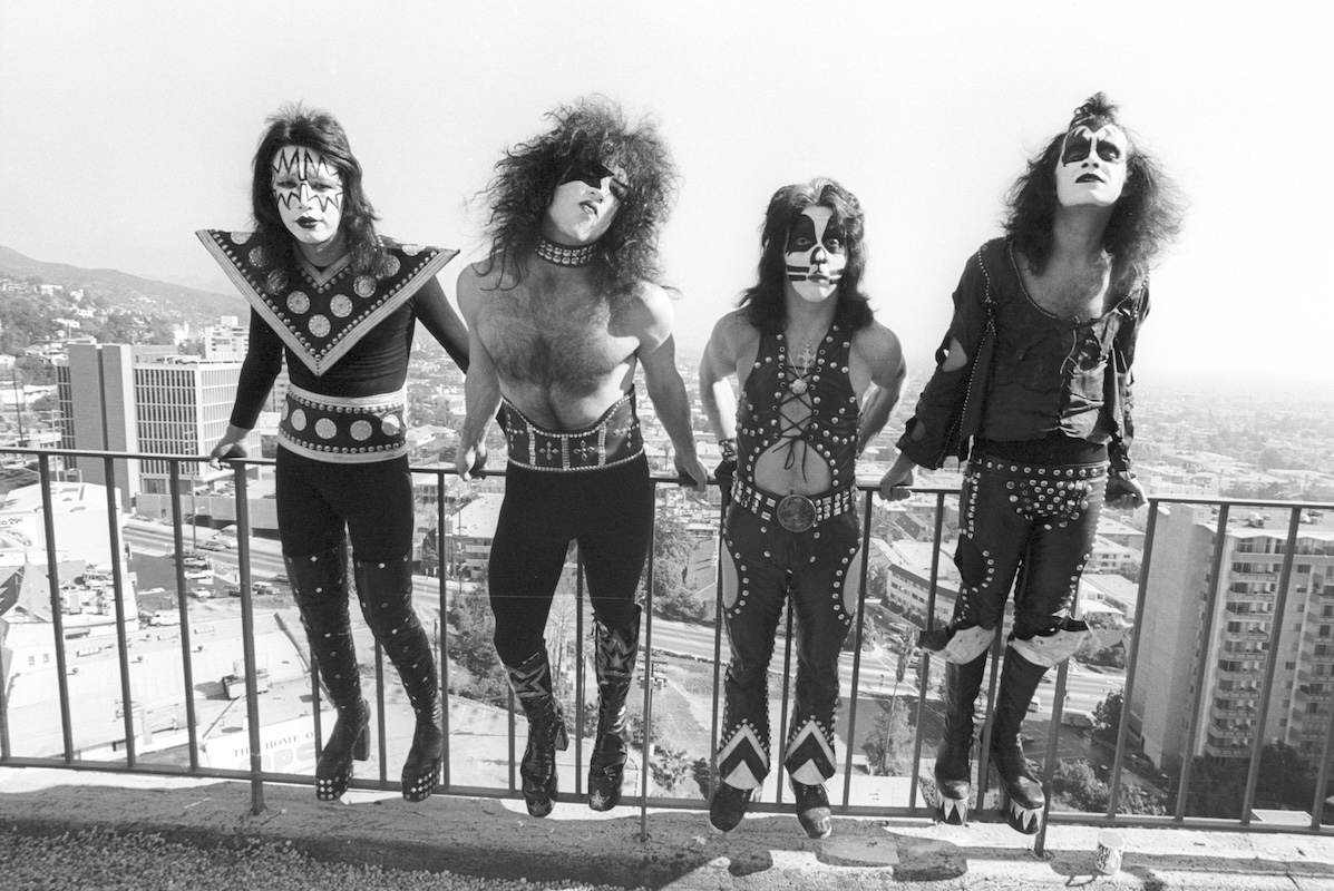 Kiss pose for a portrait session in black and white, wearing full performance dress