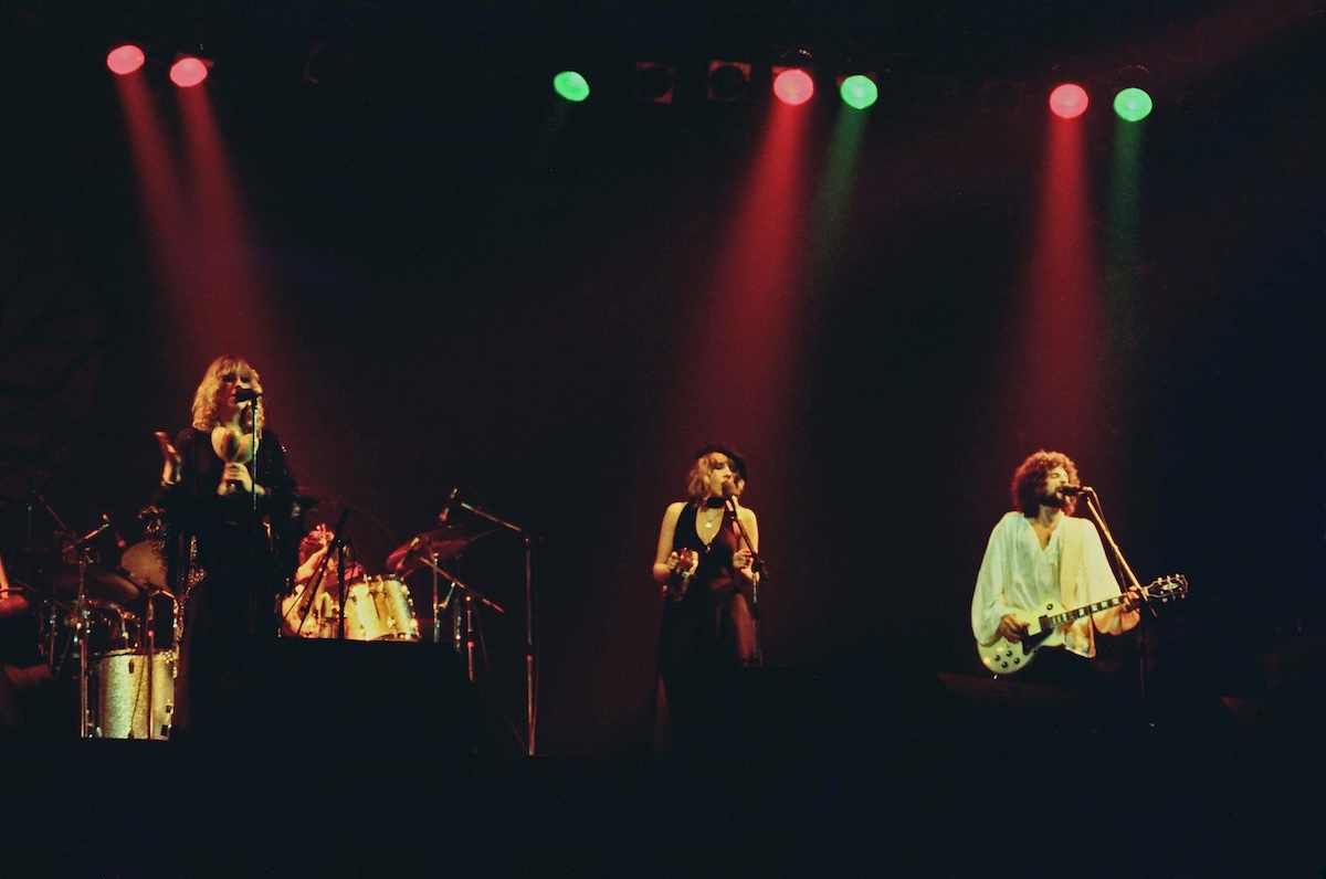 Christine McVie, Stevie Nicks and Lindsey Buckingham of Fleetwood Mac perform on stage