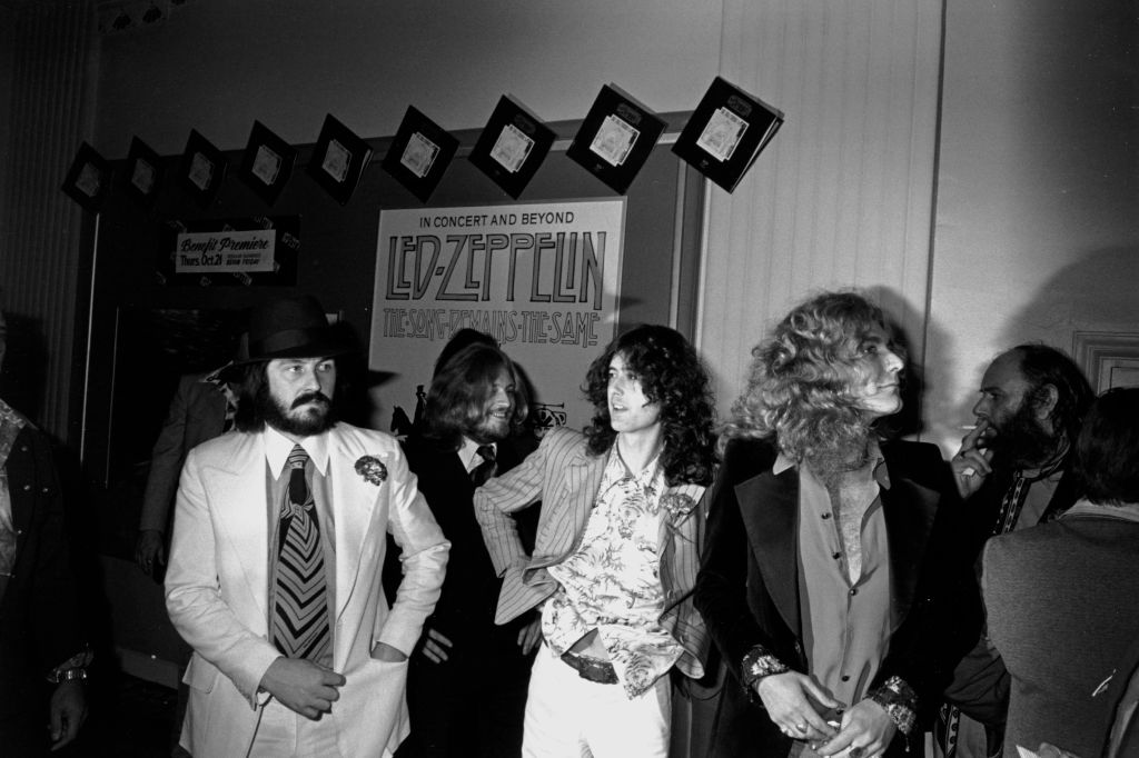 Led Zeppelin arrive for the premiere of their concert film The Song Remains The Same at the Fox Wilshire theater, Los Angeles, October 21, 1976. L-R John Bonham, John Paul Jones, Jimmy Page, Robert Plant