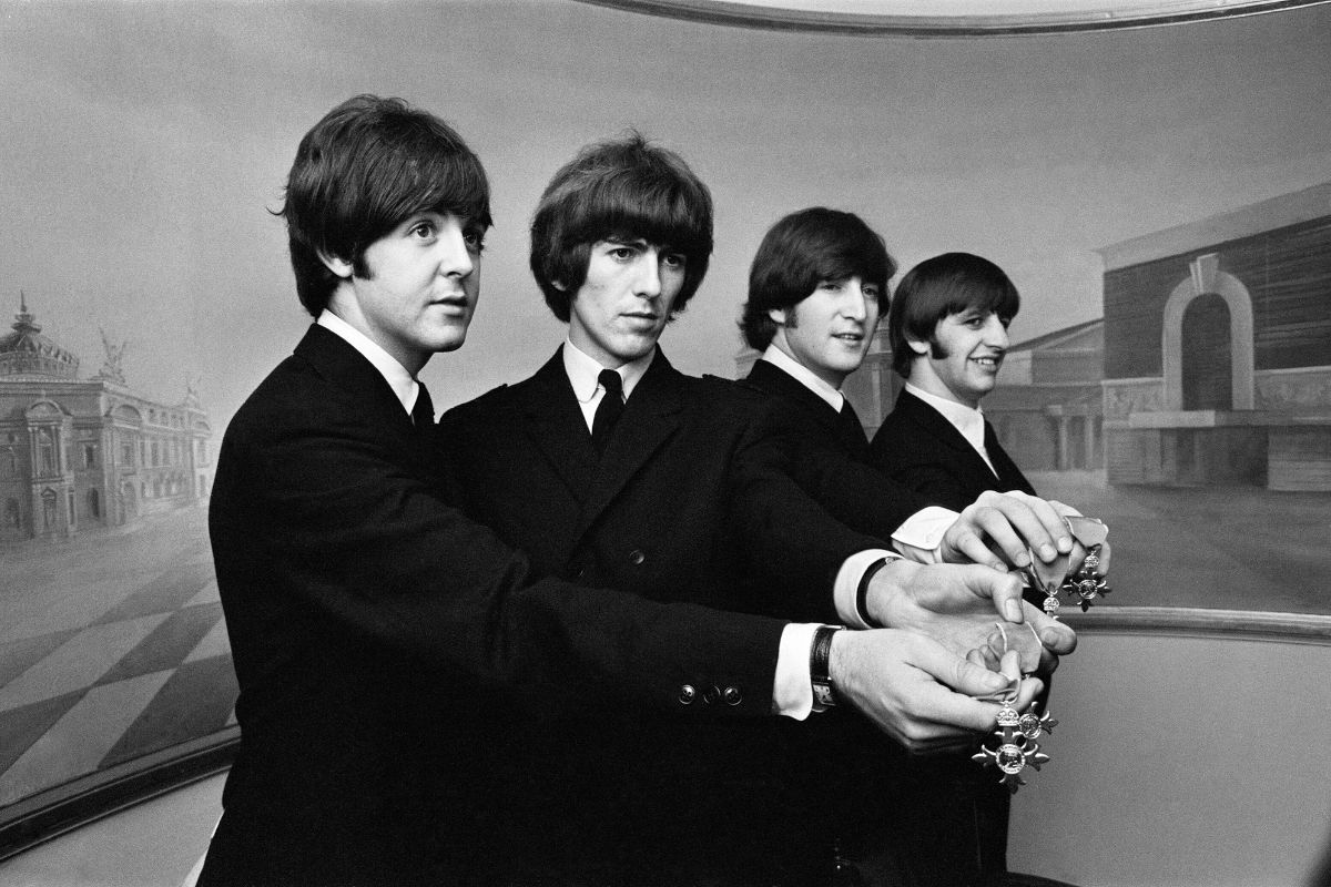 The Beatles show off their MBE medals after the royal investiture at Buckingham Palace, London, Tuesday 26th October 1965