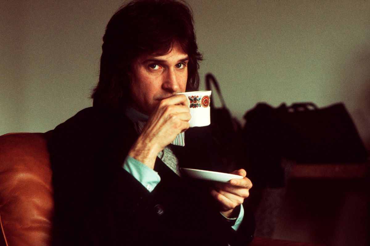Ray Davies of The Kinks, holding a tea cup at a record company office in London, 11th April 1975