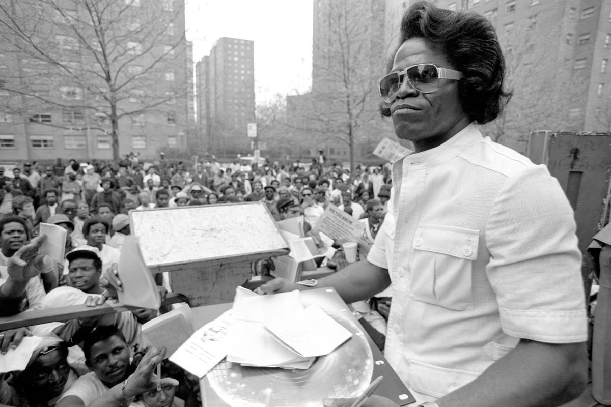 James Brown, funk and soul singer, signing autographs, 1979