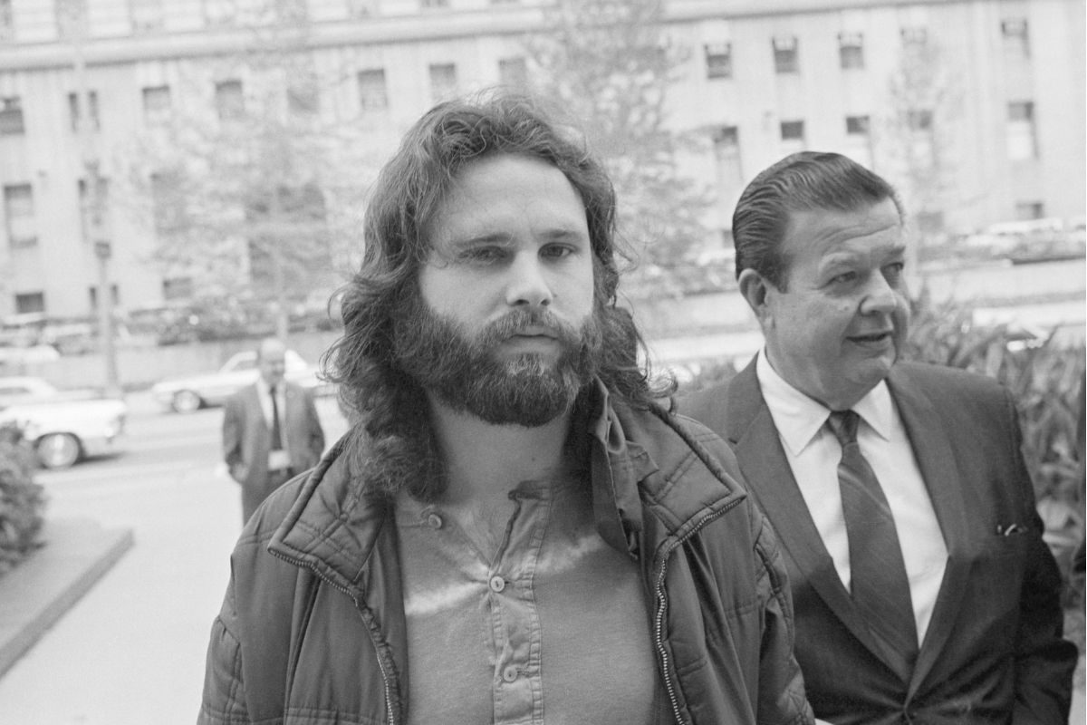 Jim Morrison arrives with his attorney for extradition proceedings to Florida, where he is charged with lewd and lascivious behaviour onstage, 1971