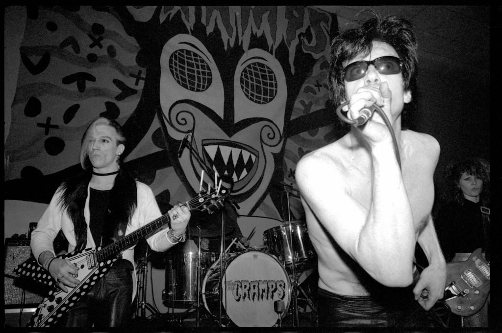 L-R: Bryan Gregory, Lux Interior, 'Poison' Ivy Rorschach of The Cramps perform at King's College, London, 1980
