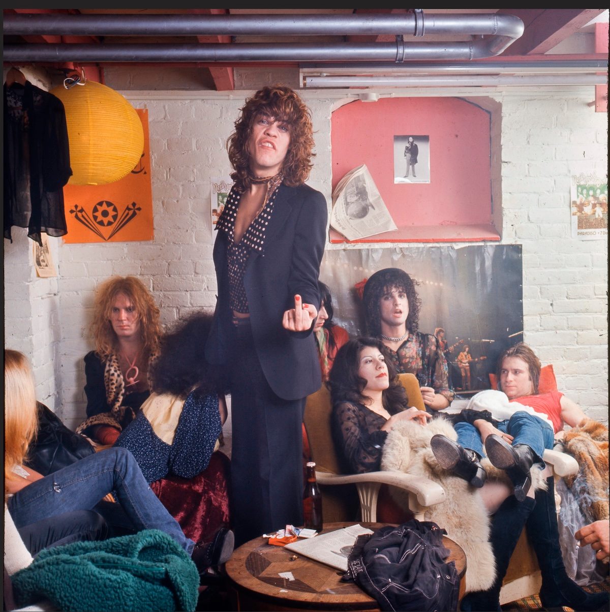 The New York Dolls in their dressing room at Paradiso, Amsterdam, 1973, lead singer holding up a middle finger