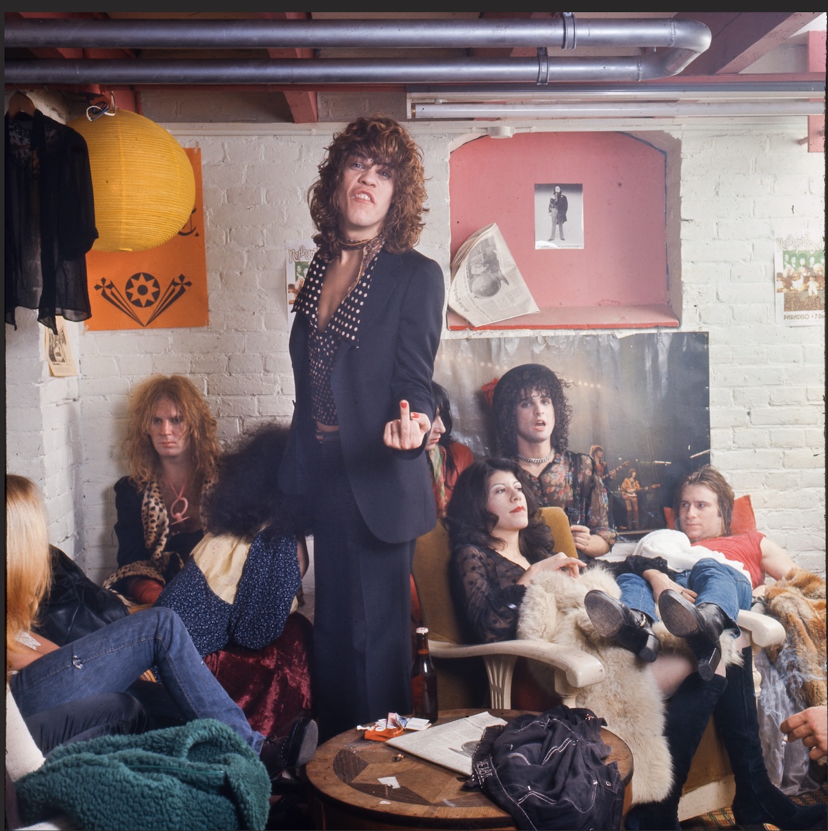 The New York Dolls in their dressing room at Paradiso, Amsterdam, 1973, lead singer holding up a middle finger