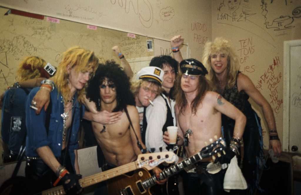 L-R Duff McKagan, Slash, Izzy Stradlin, Axl Rose and Steven Adler of Guns n' Roses backstage after opening for Johnny Thunders on March 21, 1986 at Fenders Ballroom 5, Long Beach, California