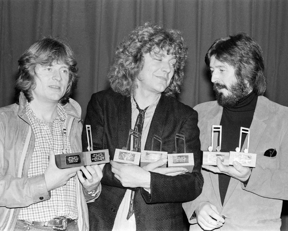 Led Zeppelin at the November 1979 Melody Maker Pop Awards. L-R: John Paul Jones, Robert Plant and John Bonham 