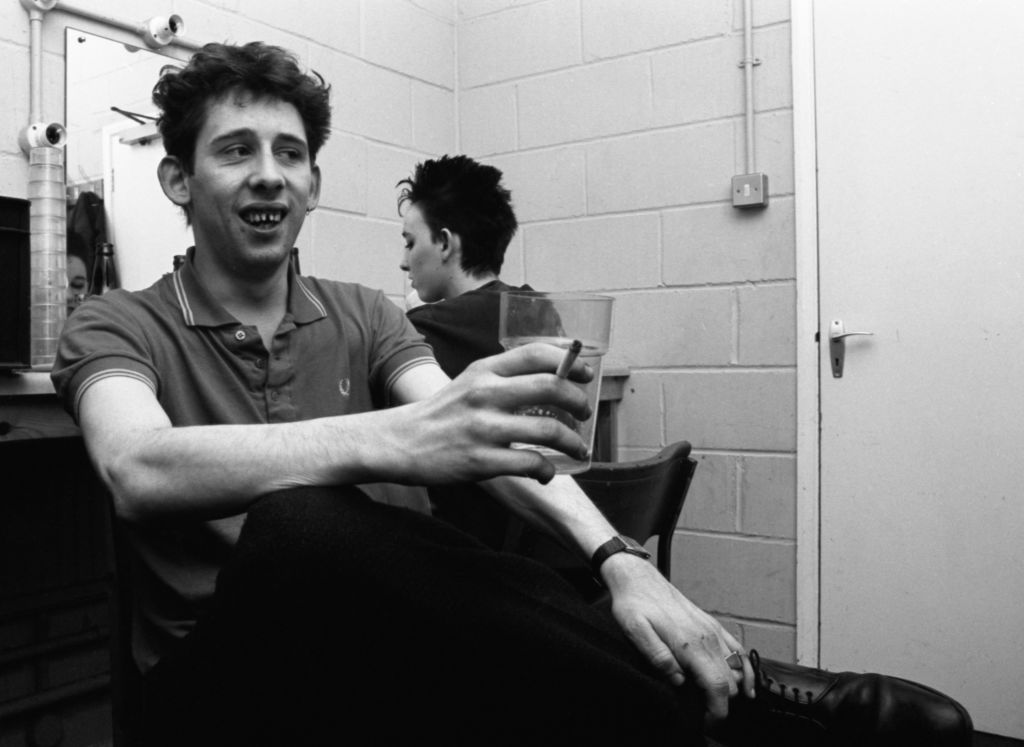 Cait O'Riordan and Shane MacGowan relax backstage before a Pogues gig in Reading, UK, 1985