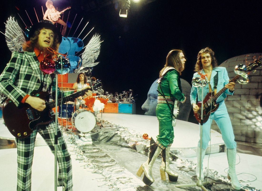 Slade: (L-R) Noddy Holder, Don Powell, Dave Hill and Jim Lea perform on a Christmas TV show in December 1973