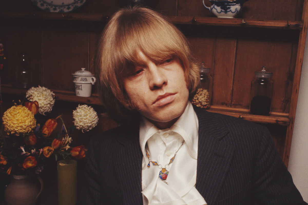 Brian Jones from The Rolling Stones posed wearing a white silk shirt in May 1968