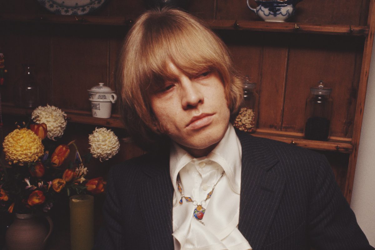 Brian Jones from The Rolling Stones posed wearing a white silk shirt in May 1968