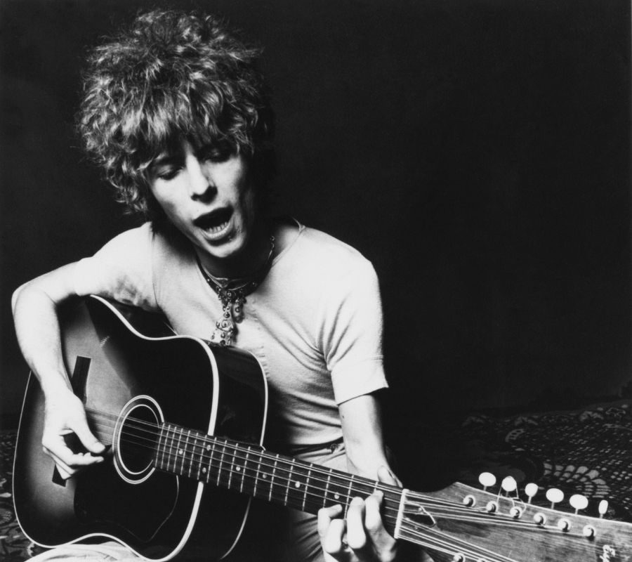 David Bowie plays an acoustic Spanish 12-string guitar to promote the release of his album "Space Oddity" in November 1969 in London, England