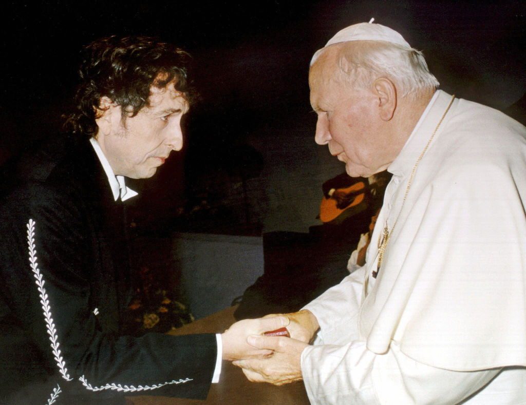 Pope John Paul II greets Bob Dylan after he performed during a Catholic Youth rally in the city of Bologna, Italy, 27 September 1997