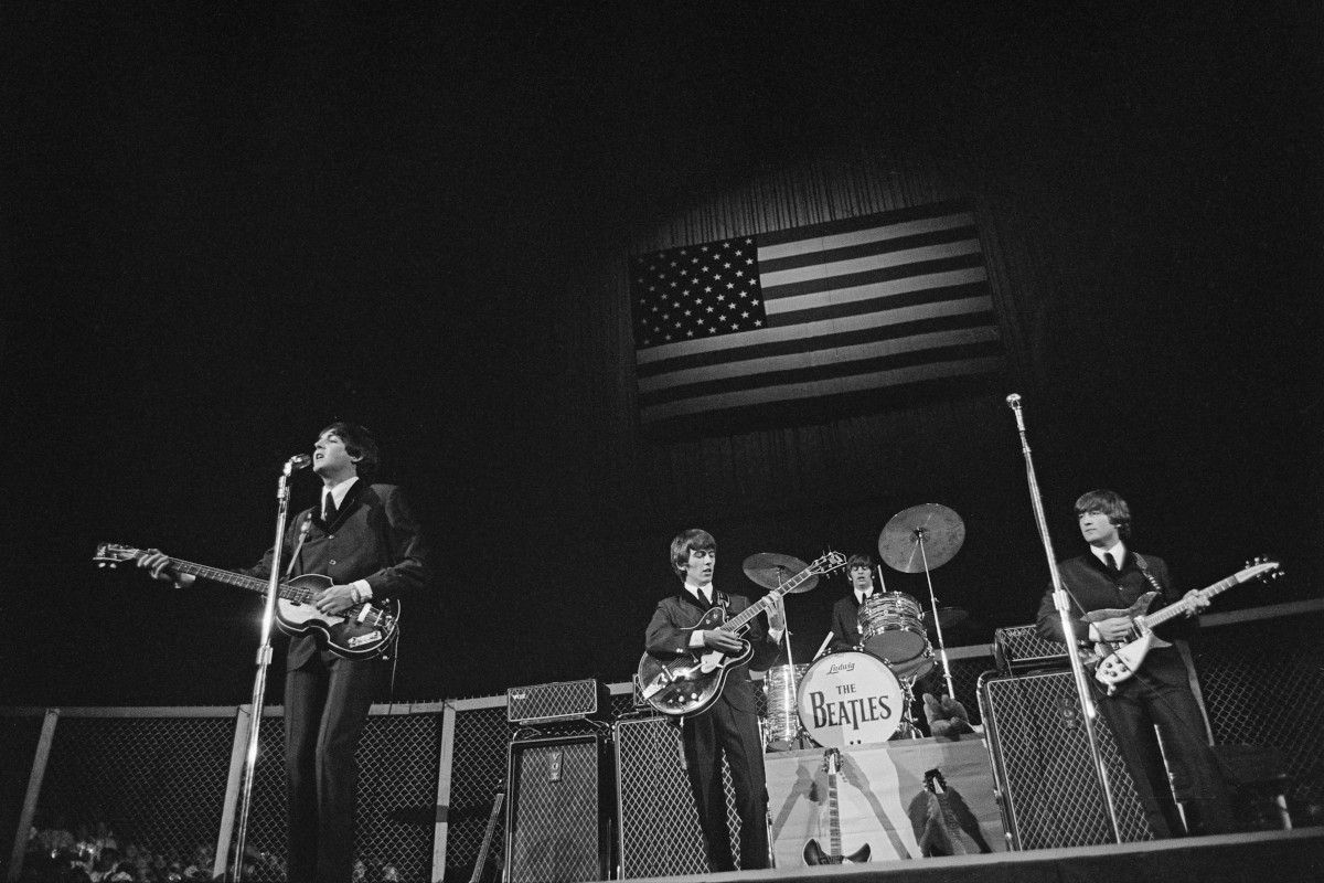 The Beatles performing at the Cow Palace, 1964. L to R: Paul McCartney, George Harrison, Ringo Starr and John Lennon