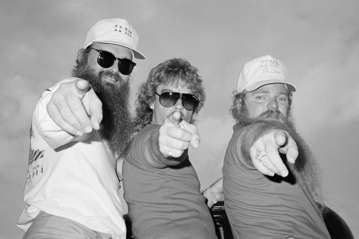 ZZ Top posed backstage at Donnington Festival, 20th August 1983. Left to Right: Billy Gibbons, Frank Beard, Dusty Hill