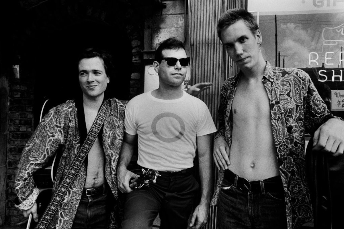 Portrait of Violent Femmes as they pose outside Tuts, Chicago, Illinois, June 30, 1983. From left: Gordon Gano, Victor DeLorenzo, and Brian Ritchie
