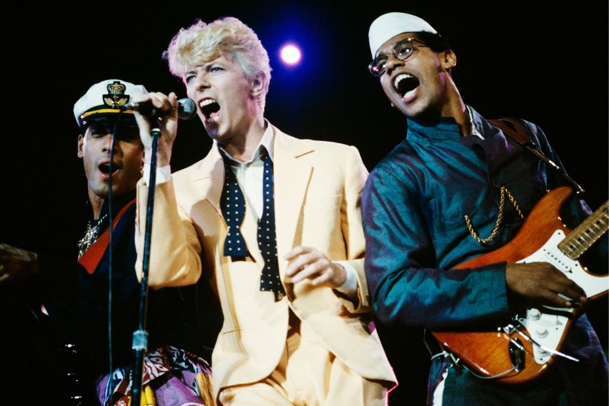 David Bowie (centre) performing with bassist Carmine Rojas (left) and Carlos Alomar during the Serious Moonlight tour, Canada, 9 August 1983