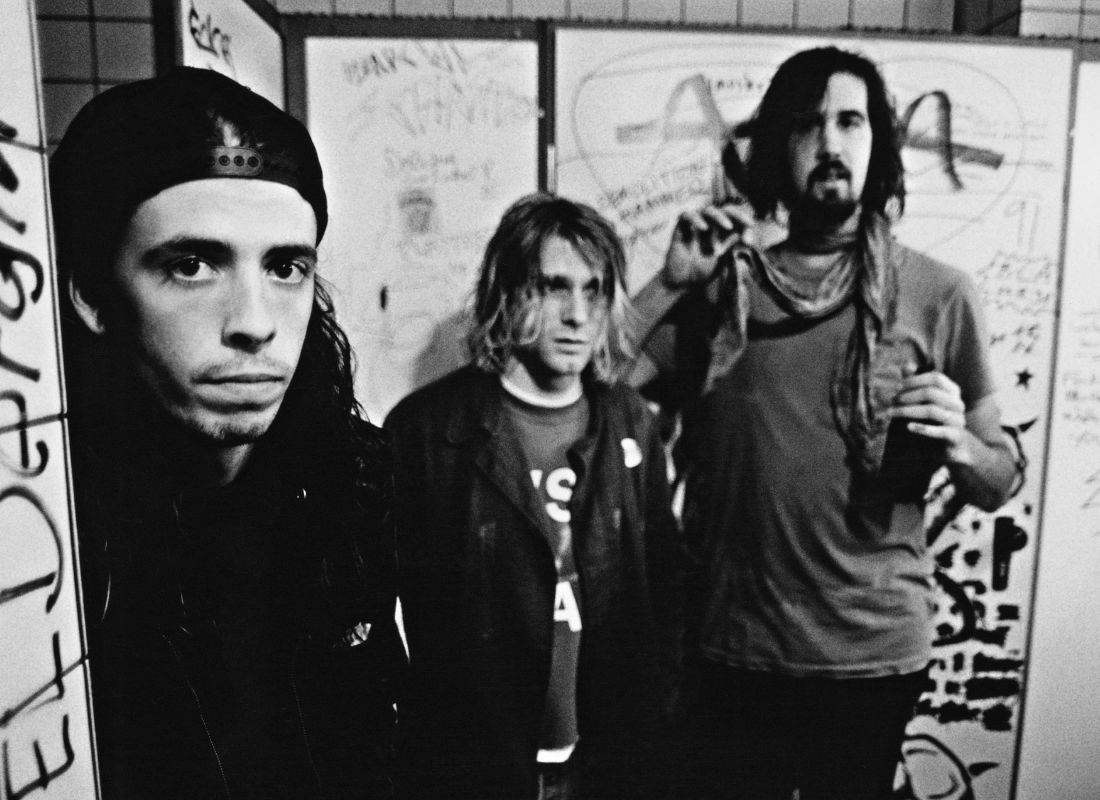 Nirvana, backstage in Frankfurt, Germany, 12 November 1991. Left to right: drummer Dave Grohl, singer and guitarist Kurt Cobain and bassist Krist Novoselic