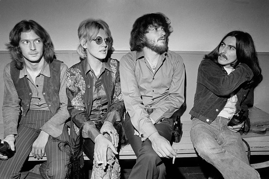 Eric Clapton (far left) and George Harrison (far right) backstage with Bonnie Bramlett and Delaney Bramlett aka Delaney and Bonnie, with whom they've both just guested, December 1969