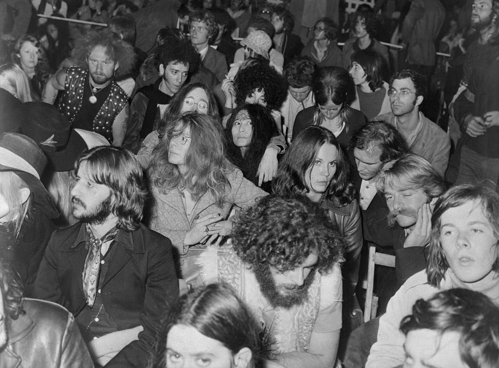 Part of the crowd at Bob Dylan's performance at the Isle of Wight Festival, 1 September 1969. John Lennon and his wife Yoko Ono are visible, centre; Ringo Starr is front left with his wife Maurreen, just out of shot