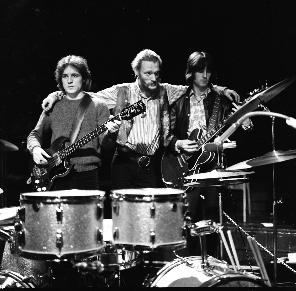 A pensive (L-R) Jack Bruce, Ginger Baker and Eric Clapton from Cream during their farewell performance at the Royal Albert Hall, 26 November 1968