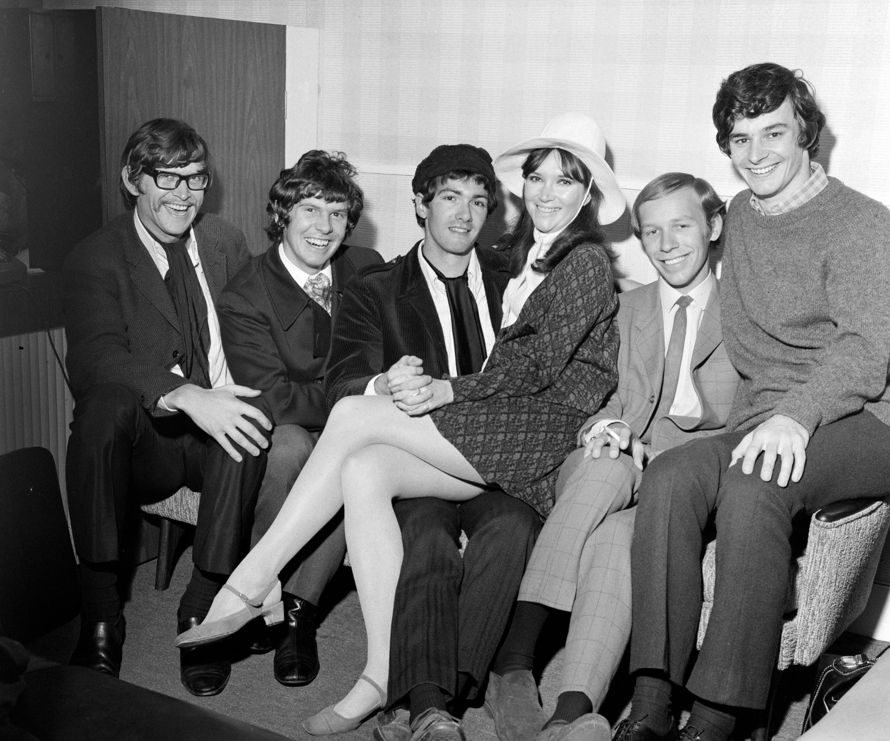 Paul Atkinson, lead guitarist of English pop group The Zombies, with his fiancee Molly Molloy,an American dancer, pictured in London. Here they are (in centre) pictured with other band members left to right: Chris White, Rod Argent, Hugh Grundy and Colin Blunstone, 15th September 1967