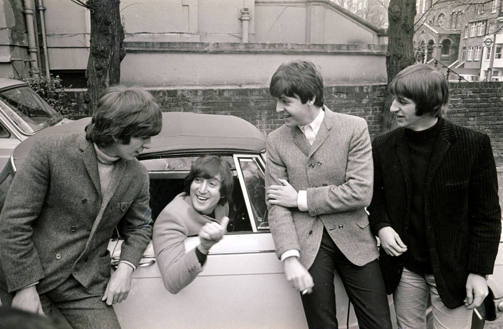 The Beatles congratulate John Lennon after passing his test, 15 February 1965