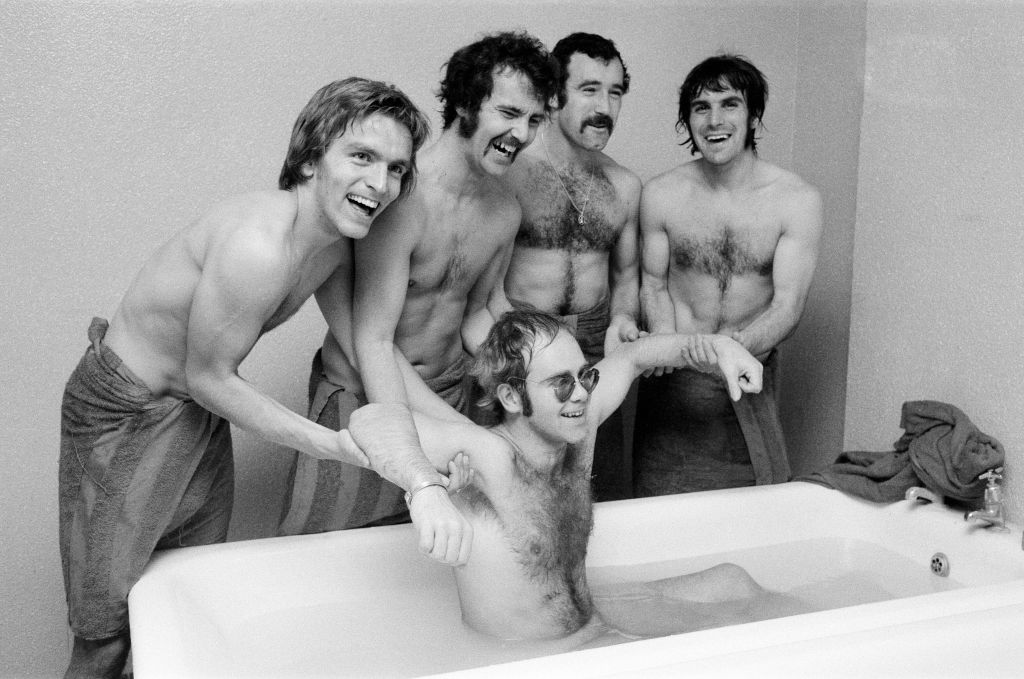 Elton John with Watford Football Club players, 1973