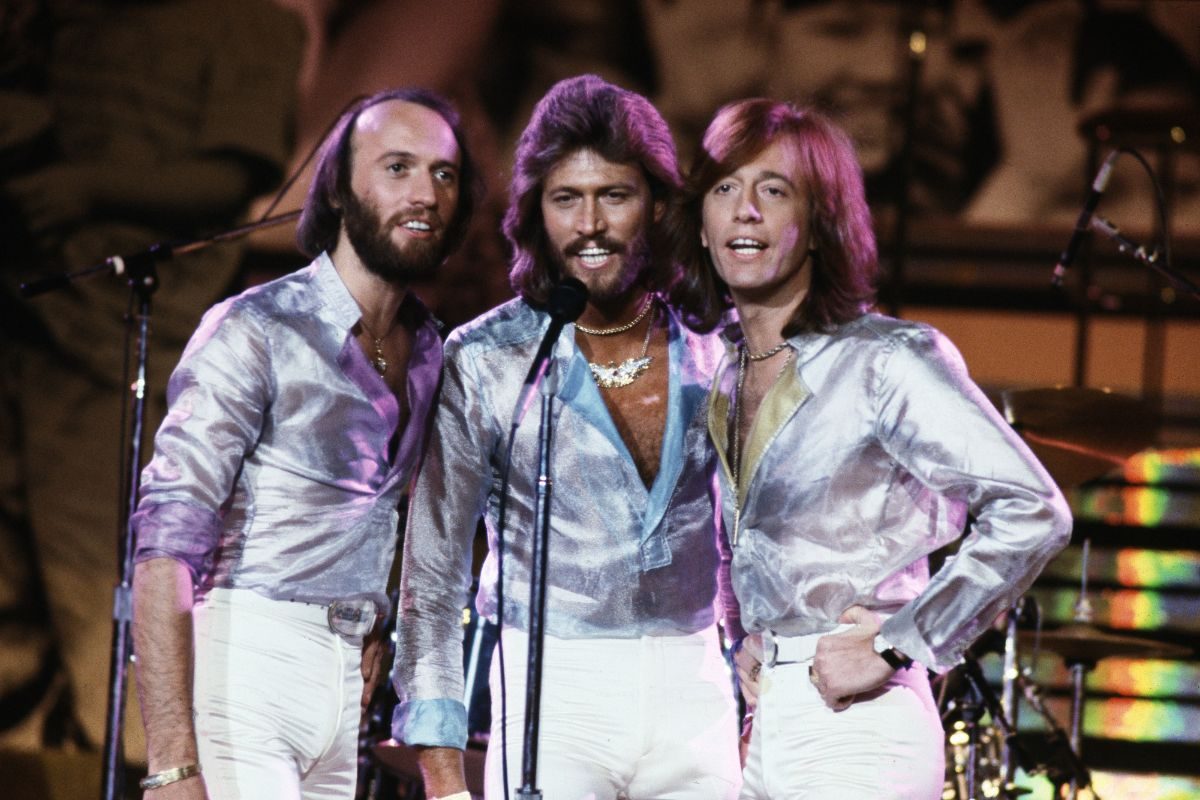 Bee Gees performing at the Music for UNICEF Concert, New York City, January 1979. Left to right: Maurice, Barry, and Robin Gibb