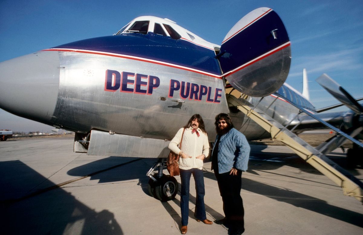Keyboardist Jon Lord (left) in front of the Deep Purple jet during the band’s 1975 Far East tour