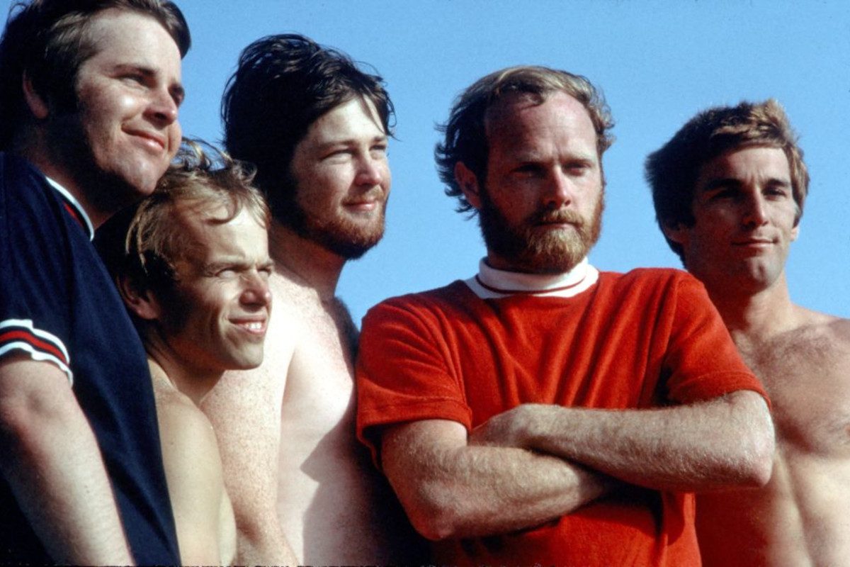 Portrait of the Beach Boys as they pose on a beach, Los Angeles, California, July 1967