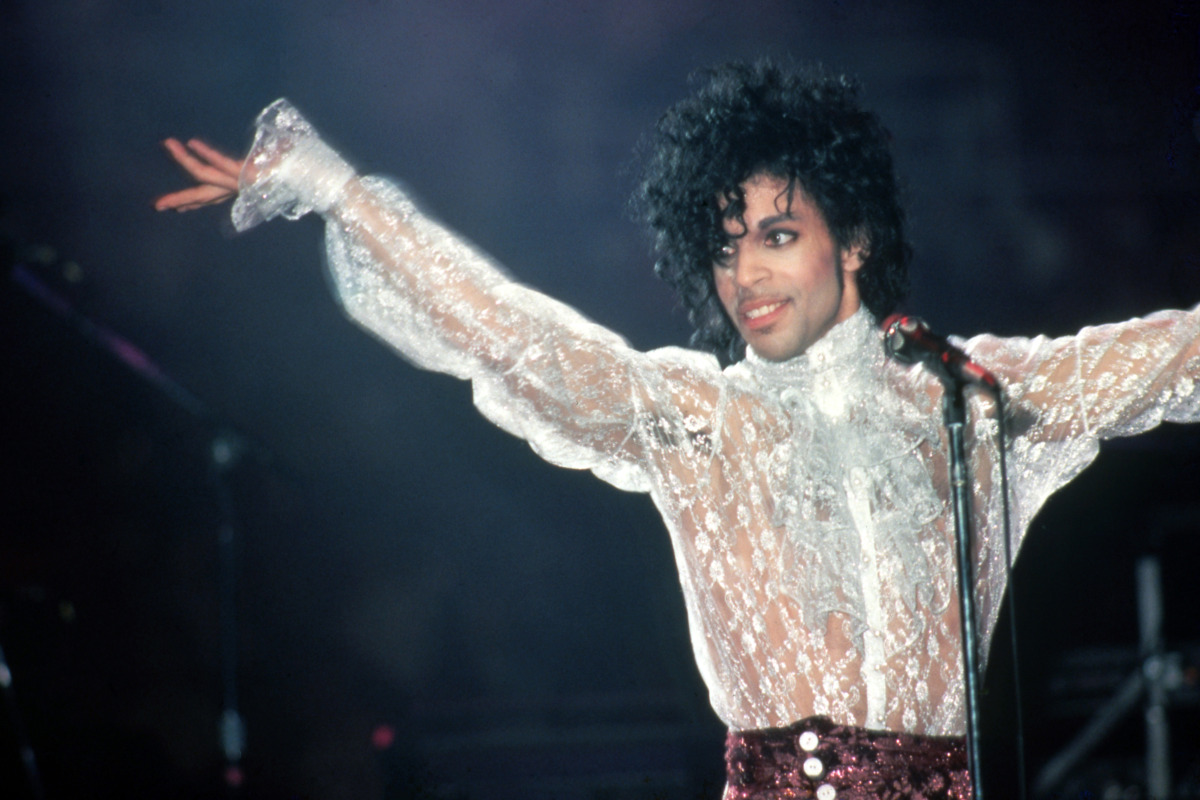 Prince performs onstage during the 1984 Purple Rain Tour on November 4, 1984