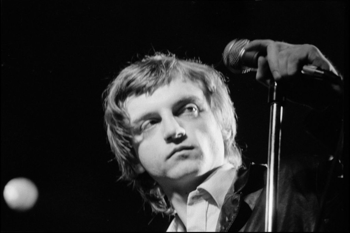 Mark E Smith of The Fall performing at The Lyceum Theatre, London, UK on 12 December 1982