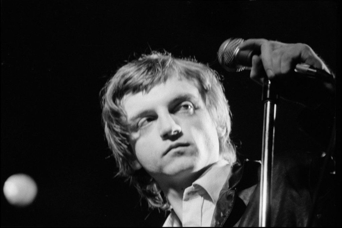 Mark E Smith of The Fall performing at The Lyceum Theatre, London, UK on 12 December 1982