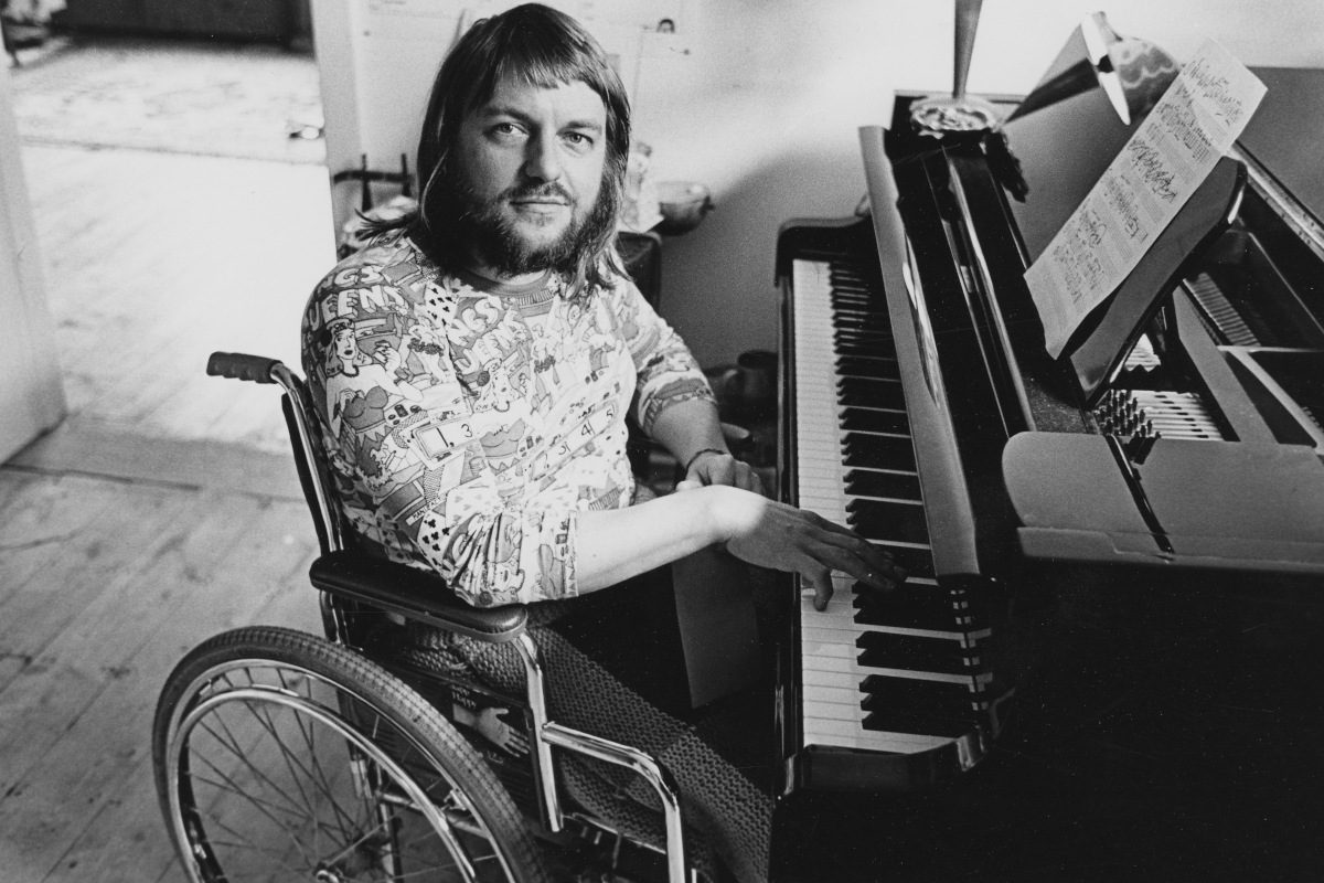 Portrait of Robert Wyatt playing the piano, September 1974
