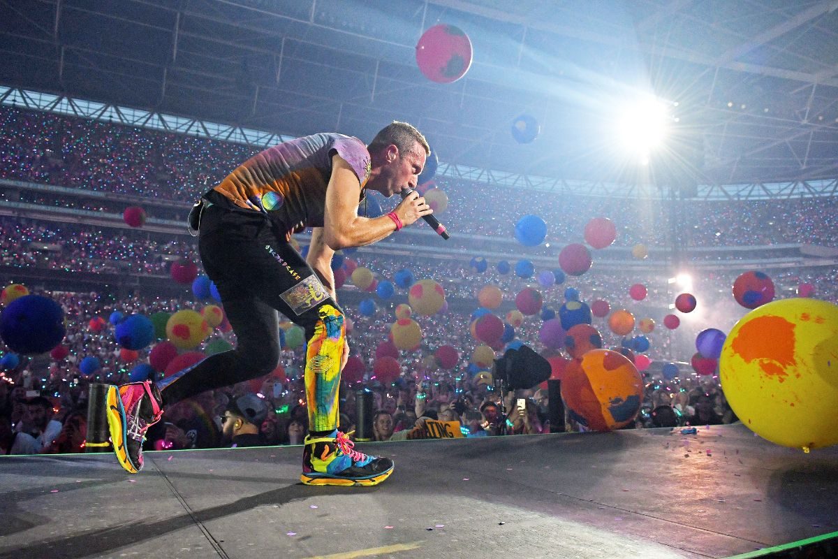 Chris Martin of Coldplay on stage at Wembley Stadium during the Music of the Spheres World Tour on 12 August, 2022