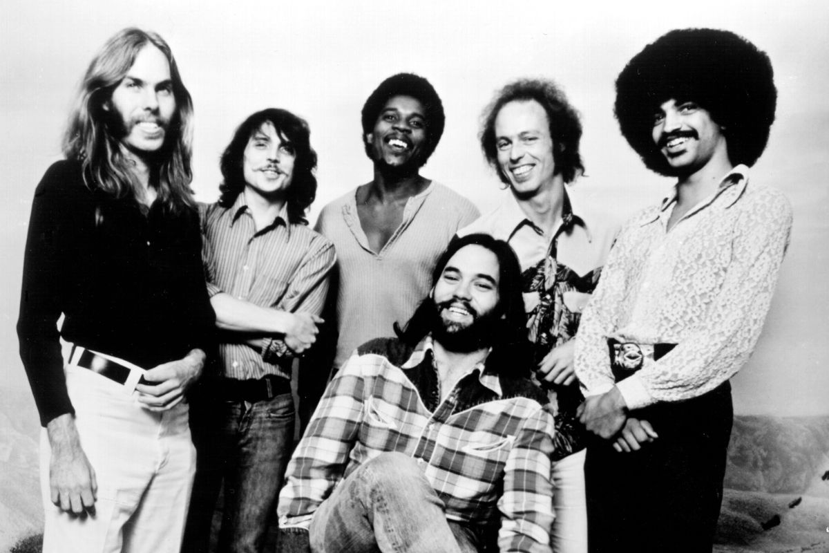 Little Feat, 1974. L-R keyboardist Bill Payne, drummer Richie Hayward, percussionist Sam Clayton, singer and guitarist Lowell George (seated), guitarist Paul Barrere and bassist Kenny Gradney