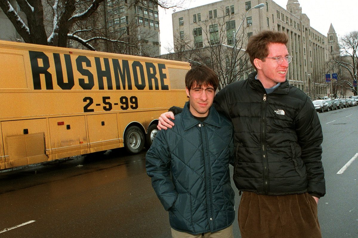 Actor Jason Schwartzman and Director Wes Anderson stand outside their promotional tour bus for the movie Rushmore