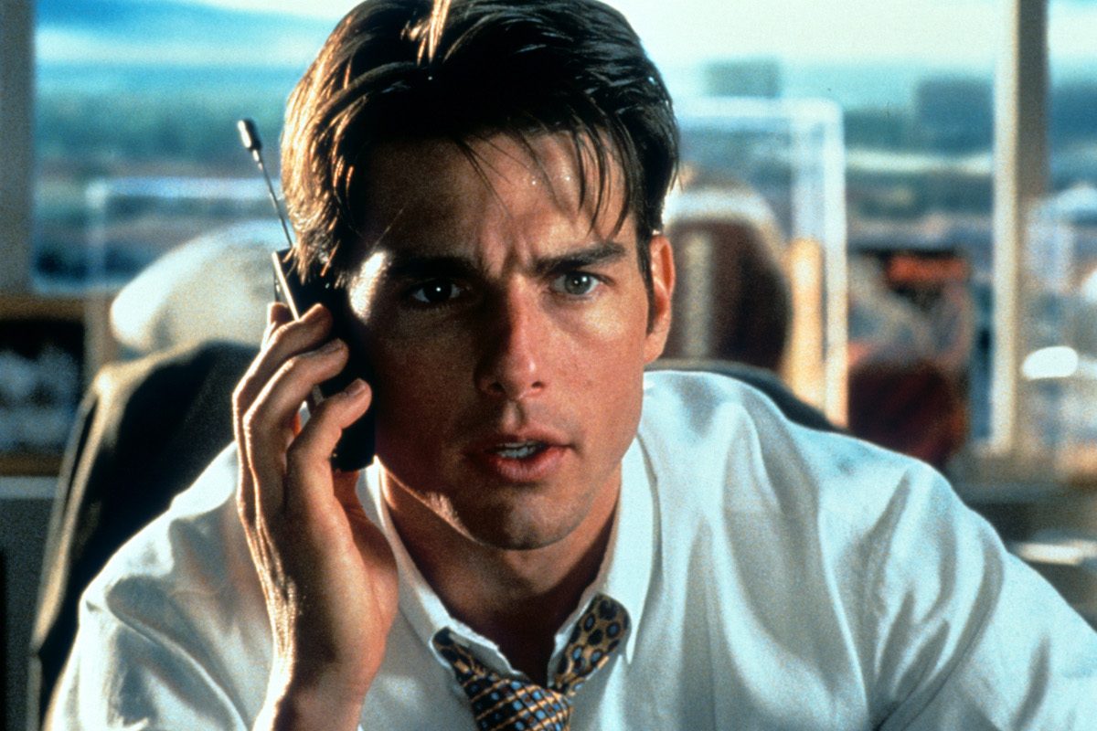 Tom Cruise talks on a phone in a scene from the film 'Jerry Maguire', 1996
