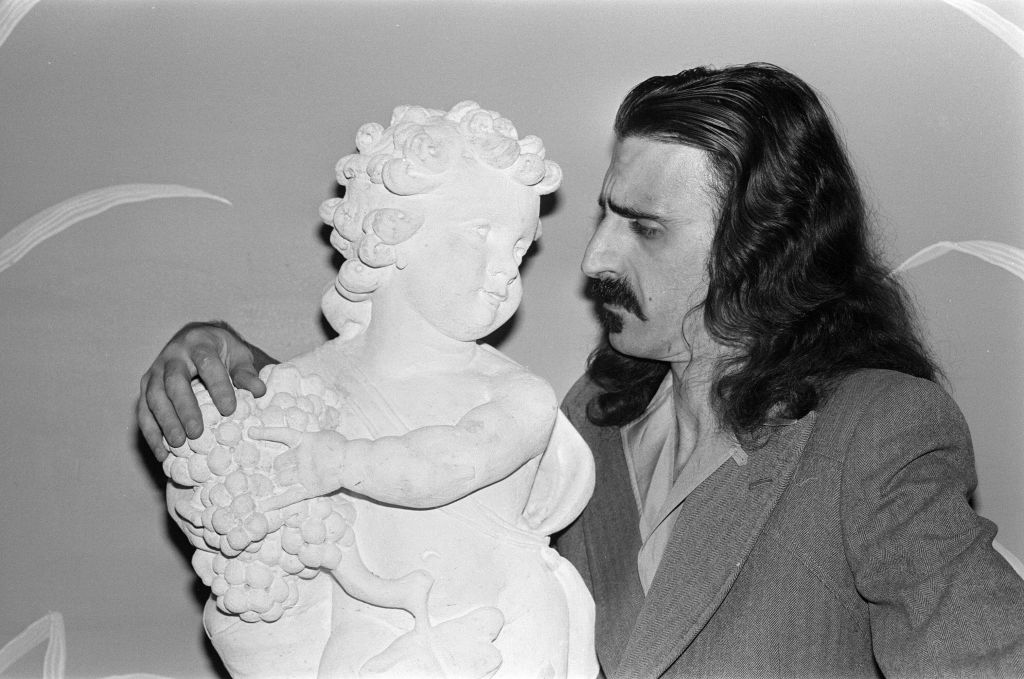 Frank Zappa considers a cherub at The Dorchester Hotel in London, February 8 1977