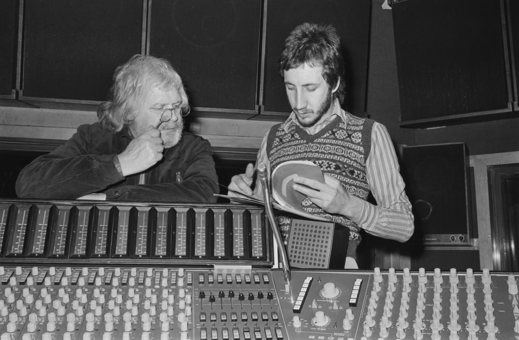 English film director Ken Russell (1927 - 2011) and musician Pete Townshend (right) of rock band the Who in a recording studio during the making of the band's rock opera 'Tommy', UK, 29th March 1974